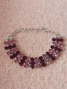 Costume Bracelet with Alternating Light and Dark Purple Reflective Stones.